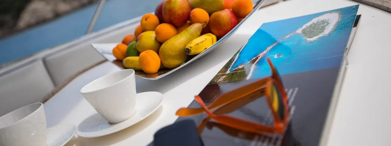 Relax on deck with panoramic views of rocky coastlines and hidden coves and plan your next adventure with our curated travel brochures