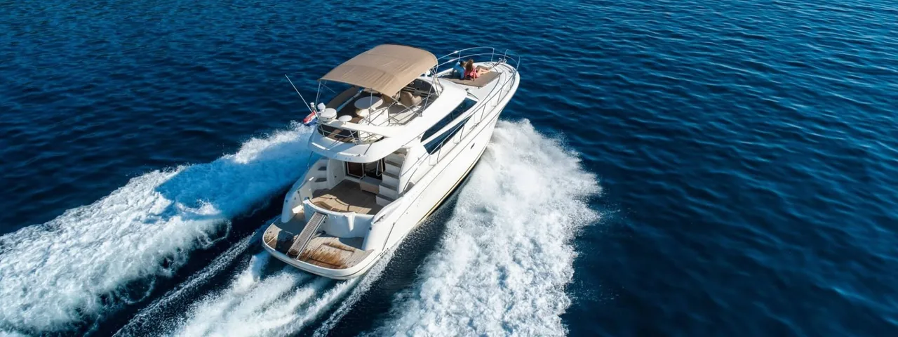Luxury yacht Prestige 42 cruising on deep blue Adriatic Sea near Dubrovnik, offering premium comfort and style for unforgettable Croatian adventures