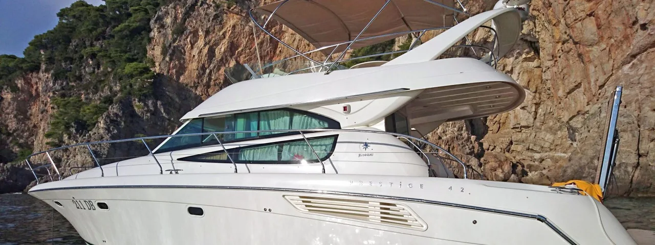 Luxury yacht cruising along Dubrovnik's stunning coastline, offering exclusive charter experiences for discerning travelers