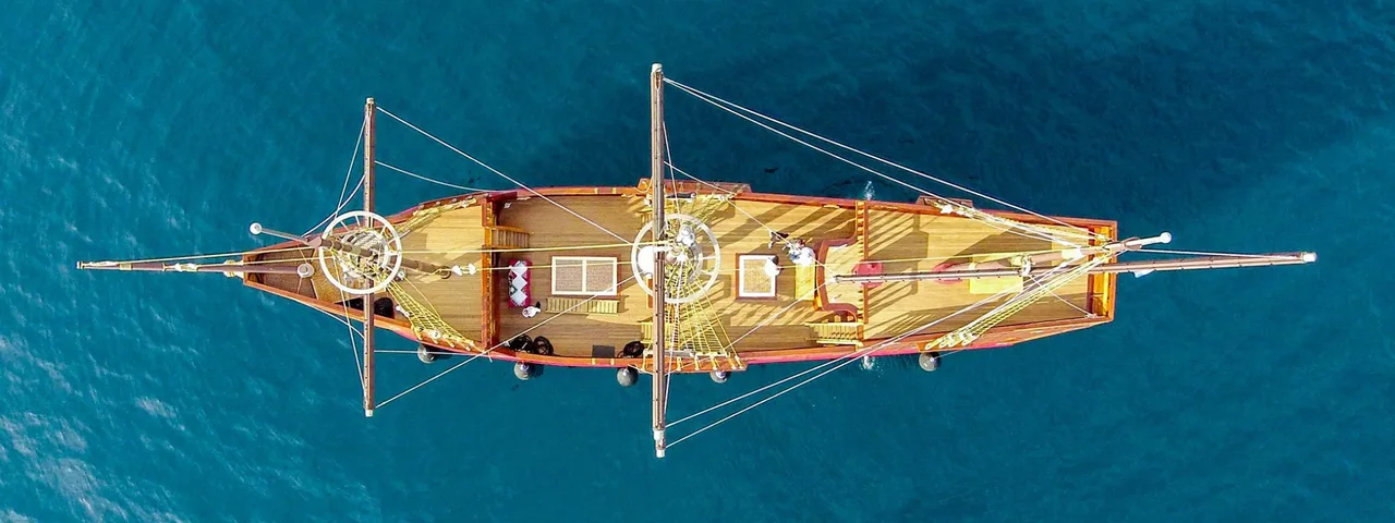 Aerial view of a Dubrovnik luxury event ship cruising over the blue Adriatic Sea