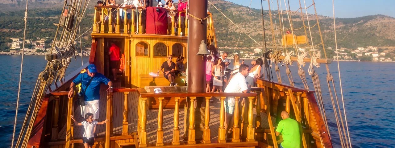 Guests on the wooden deck of a Dubrovnik luxury group event ship