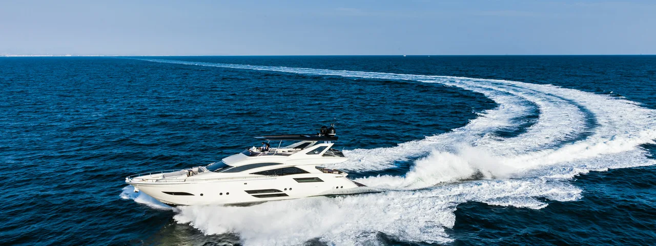 Private yacht cruising the Adriatic along the Budva Riviera near Sveti Stefan, Montenegro