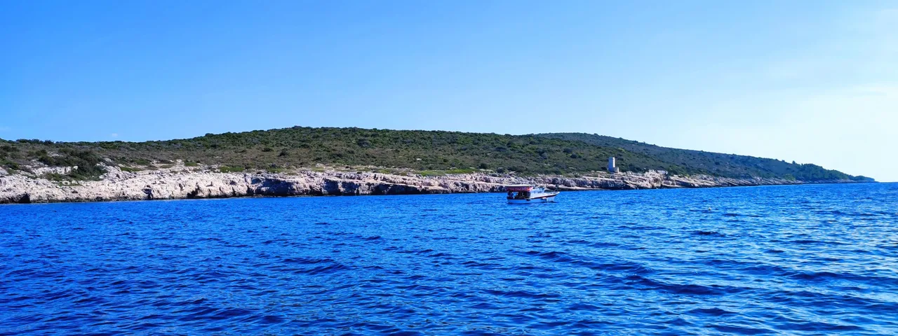 Stunning blue Adriatic waters meet rugged coastline near Hvar, Island Scedro, perfect for unforgettable boat tours and island exploration