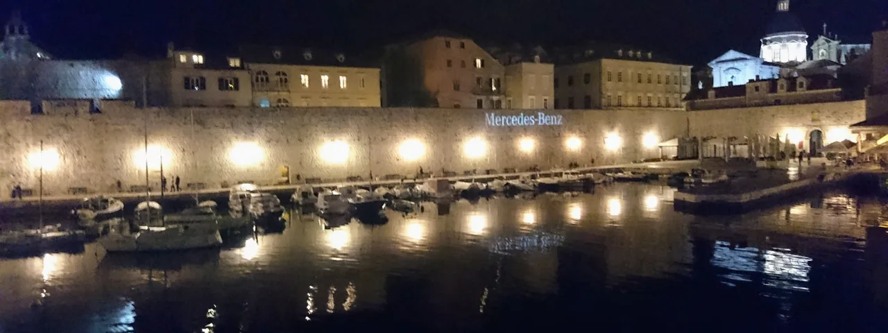 Dubrovnik Old Town harbor at night. Book your Croatian escape with Tendo Luxury Travel.