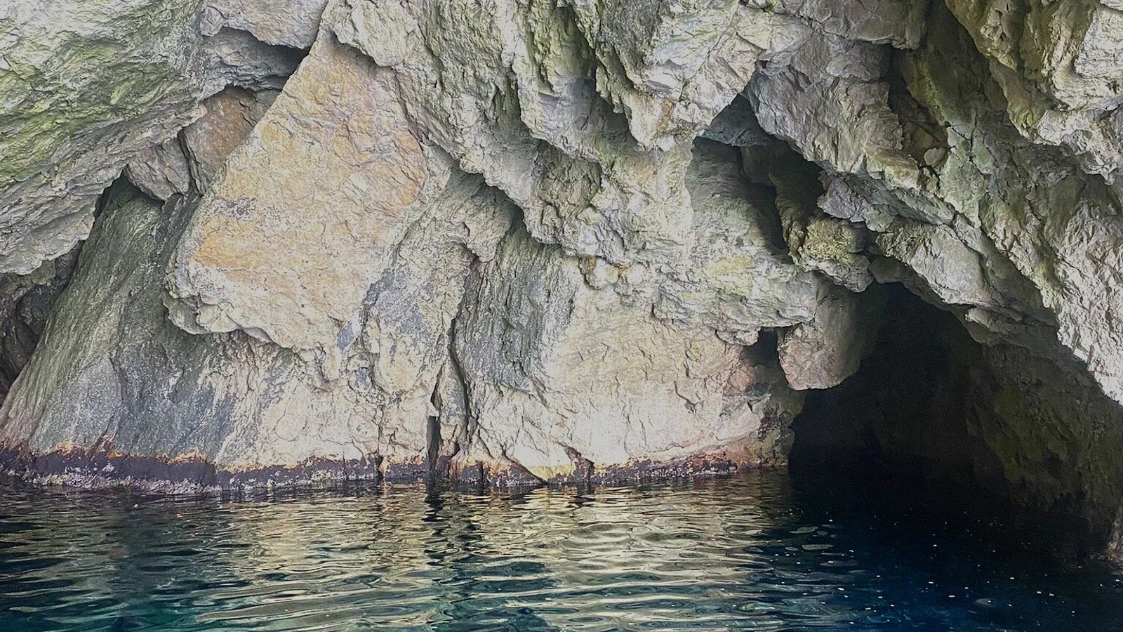 Private Blue Cave Tour Dubrovnik speedboat entering the Blue Cave at ideal midday light
