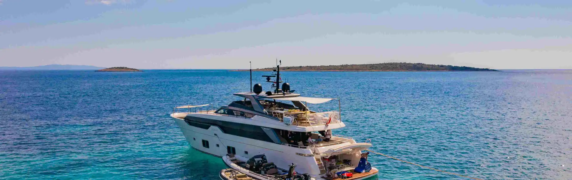 Luxurious yacht cruising turquoise Adriatic waters near Dubrovnik, perfect for exclusive Croatian coastal adventures