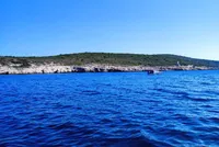 Stunning blue Adriatic waters meet rugged coastline near Hvar, Island Scedro, perfect for unforgettable boat tours and island exploration