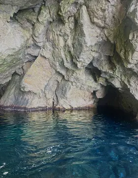 Private Blue Cave Tour Dubrovnik speedboat entering the Blue Cave at ideal midday light