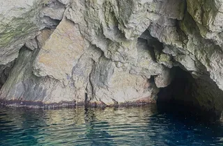 Private Blue Cave Tour Dubrovnik speedboat entering the Blue Cave at ideal midday light