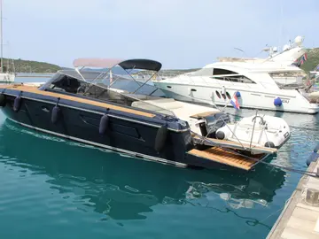 Luxury yacht ITAMA 45 moored in Dubrovnik marina, surrounded by crystal-clear Adriatic waters and lush coastal landscape
