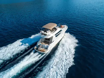 Luxury yacht Prestige 42 cruising on deep blue Adriatic Sea near Dubrovnik, offering premium comfort and style for unforgettable Croatian adventures