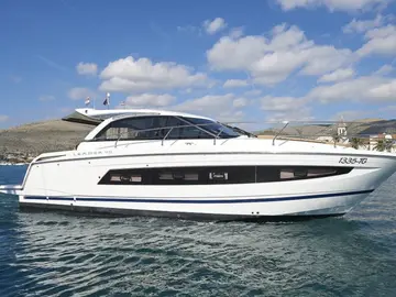 Sleek white Leader 40 luxury yacht cruising the Adriatic Sea near Trogir, offering bespoke private boat tours on the Dalmatian Coast.