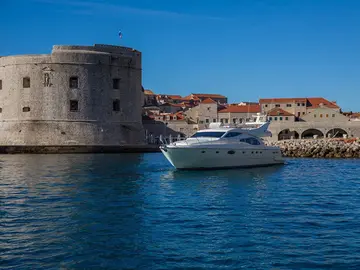 Luxury yacht tour departing from Dubrovnik old town harbor, Croatia.