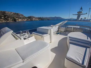 Luxury yacht deck with sunbeds, ready to set sail from Dubrovnik, Croatia.