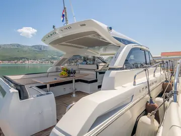 Luxury Leader 40 yacht deck with fruit, wine, and glasses, waiting for clients to embark in Dubrovnik