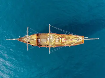 Aerial view of a Dubrovnik luxury event ship cruising over the blue Adriatic Sea