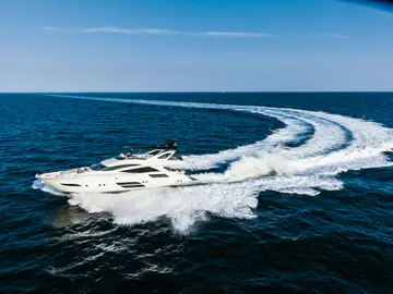 Private yacht cruising the Adriatic along the Budva Riviera near Sveti Stefan, Montenegro