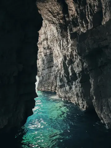 Stunning turquoise waters inside a Dubrovnik sea cave.