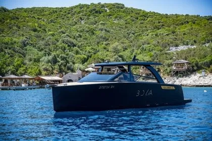 Luxury motor yacht on clear blue water near Dubrovnik island Sipan, waiting for clients in front of popular Bowa restaurant.