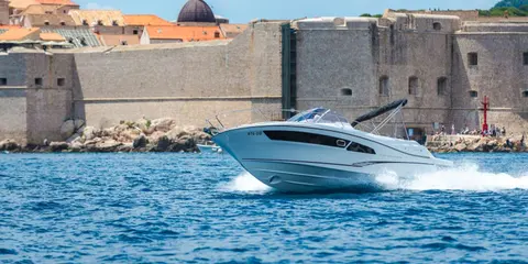 Explore Dubrovnik by boat. Speed boat Jeanneau Cap Camarat 9 Dubrovnik Old Town walls
