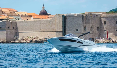 Explore Dubrovnik by boat. Speed boat Jeanneau Cap Camarat 9 Dubrovnik Old Town walls