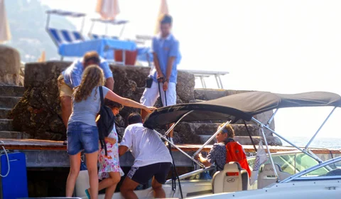 Tendo staff assists guests boarding a luxury speedboat in Dubrovnik, Croatia, ensuring a smooth and enjoyable start to their journey.
