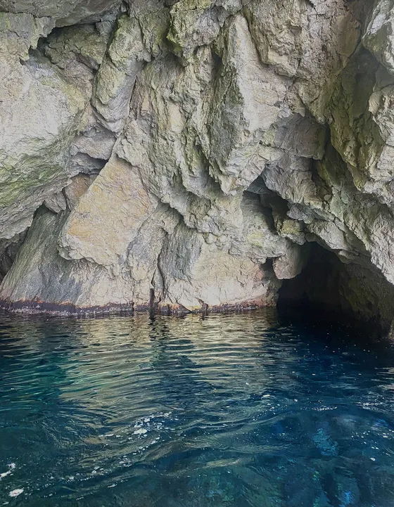 Private Blue Cave Tour Dubrovnik speedboat entering the Blue Cave at ideal midday light