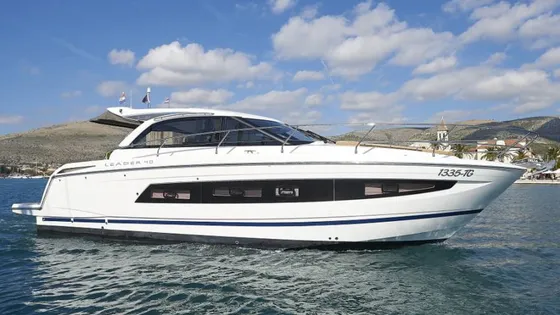 Sleek white Leader 40 luxury yacht cruising the Adriatic Sea near Trogir, offering bespoke private boat tours on the Dalmatian Coast.