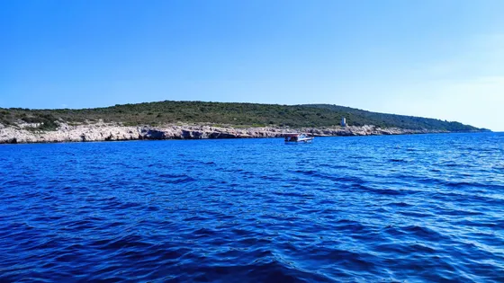 Stunning blue Adriatic waters meet rugged coastline near Hvar, Island Scedro, perfect for unforgettable boat tours and island exploration