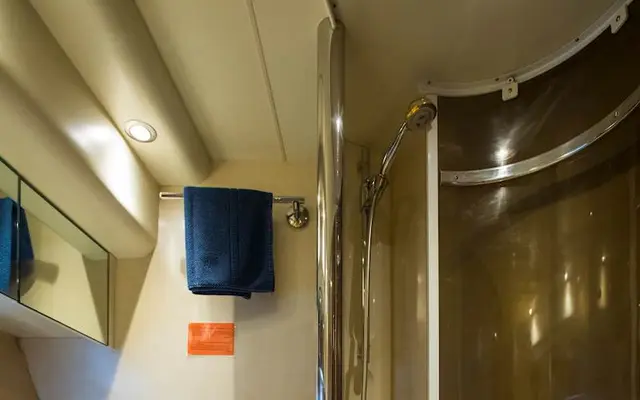 Luxury yacht bathroom interior, featuring modern amenities, sleek design, and compact efficiency for comfortable Adriatic cruising.