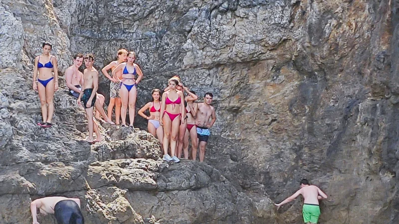 People swimming and snorkeling in front of Blue Cave - Dubrovnik boat tour