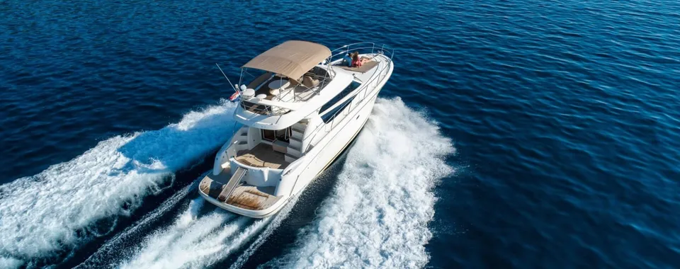 Luxury yacht Prestige 42 cruising on deep blue Adriatic Sea near Dubrovnik, offering premium comfort and style for unforgettable Croatian adventures