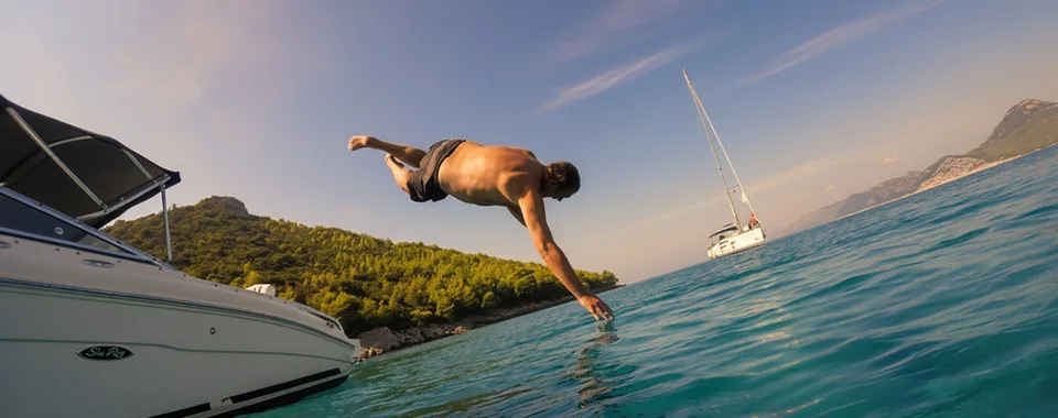 Guest diving from a private motorboat into the Adriatic during a Dubrovnik boat tour.