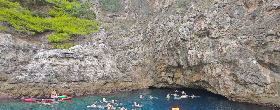 Guests swimming and snorkeling outside the Blue Cave on a private boat tour from Dubrovnik.