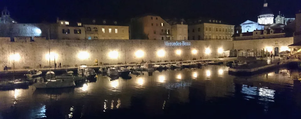 Dubrovnik Old Town harbor at night. Book your Croatian escape with Tendo Luxury Travel.