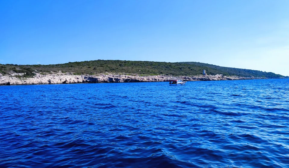 Stunning blue Adriatic waters meet rugged coastline near Hvar, Island Scedro, perfect for unforgettable boat tours and island exploration