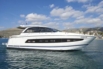Sleek white Leader 40 luxury yacht cruising the Adriatic Sea near Trogir, offering bespoke private boat tours on the Dalmatian Coast.