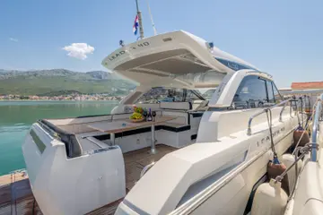 Luxury Leader 40 yacht deck with fruit, wine, and glasses, waiting for clients to embark in Dubrovnik