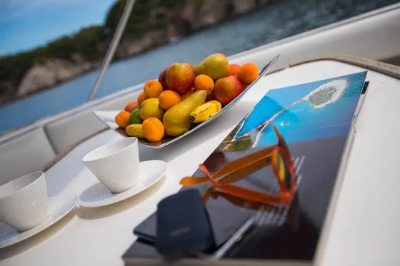 Relax on deck with panoramic views of rocky coastlines and hidden coves and plan your next adventure with our curated travel brochures
