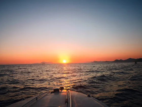 Stunning sunset over the Adriatic Sea, near Dubrovnik with silhouetted islands on the horizon.