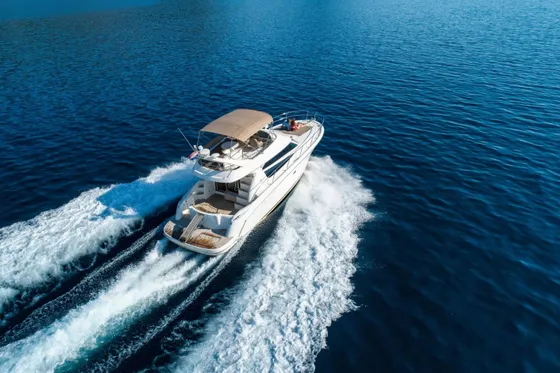Luxury yacht Prestige 42 cruising on deep blue Adriatic Sea near Dubrovnik, offering premium comfort and style for unforgettable Croatian adventures