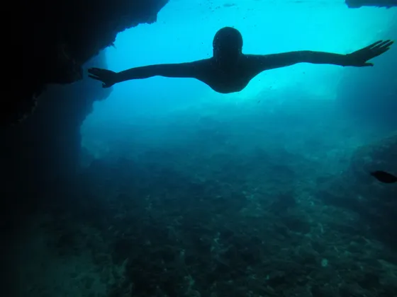 Amazing image of entering inside blue cave island Kolocep Dubrovnik