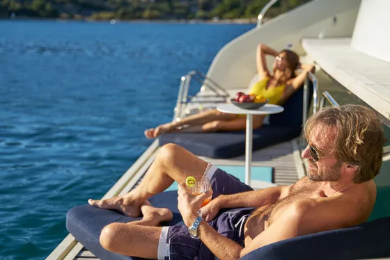 lagoon sixty 5 amada mia couple relaxing sun deck luxury charter croatia