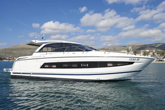 Sleek white Leader 40 luxury yacht cruising the Adriatic Sea near Trogir, offering bespoke private boat tours on the Dalmatian Coast.