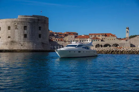 Luxury yacht tour departing from Dubrovnik old town harbor, Croatia.