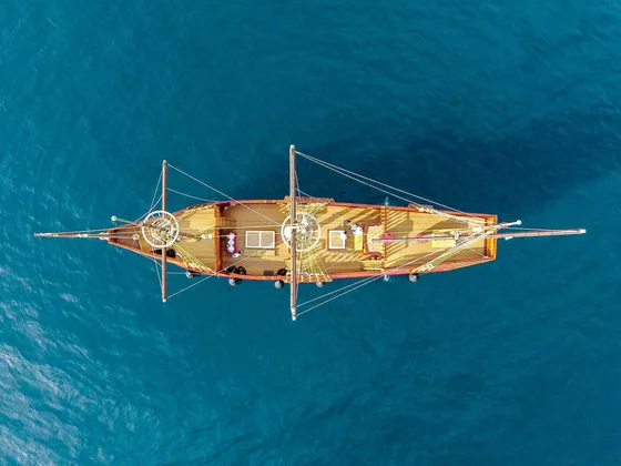 Aerial view of a Dubrovnik luxury event ship cruising over the blue Adriatic Sea