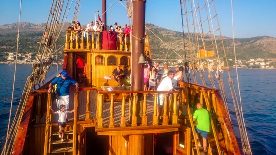 Guests on the wooden deck of a Dubrovnik luxury group event ship