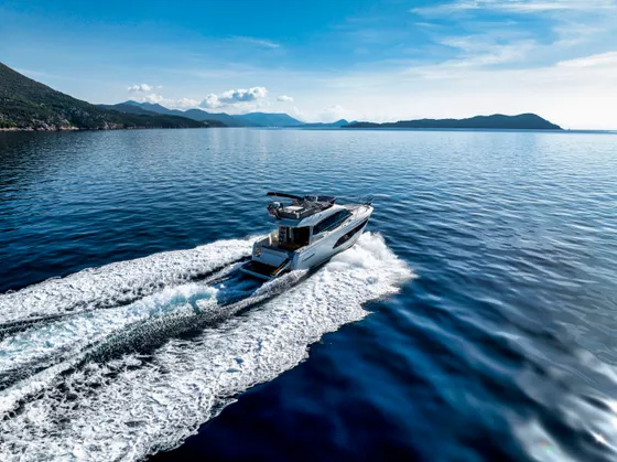 Luxury yacht charter cruising the clear blue Adriatic Sea near Dubrovnik, Croatia, with scenic islands and coastline.