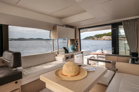 Luxury yacht interior featuring modern design, panoramic views of the Adriatic Sea near Dubrovnik, Croatia.