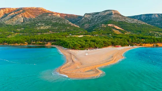 Zlatni Rat (Golden Horn) beach in Bol, Brač, Croatia, with its unique shape and turquoise waters, perfect for luxury yacht tours from Split.